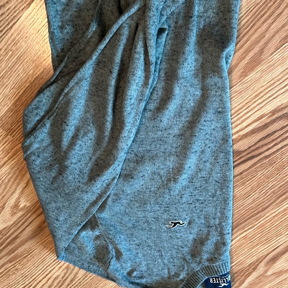 Hollister new sweater. Color is more light green than gray. Some blue threads
